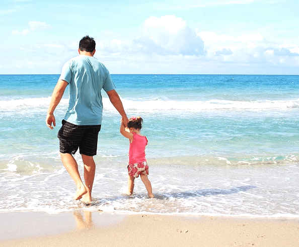 Father and daughter holding hands